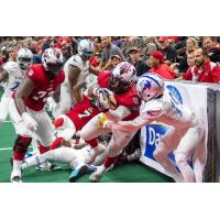 Jacksonville Sharks linebacker/fullback Zack Brown carries the ball against the Columbus Lions