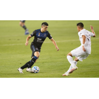 Cristian Espinoza of the San Jose Earthquakes with possession vs. the LA Galaxy