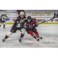 Vancouver Giants right wing Justin Lies (left) vs. the Kelowna Rockets