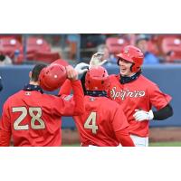 Spokane Indians celebrate after a home run