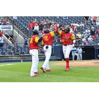 Reading Hot Dogs (Fightin Phils) outfielder Jorge Bonifacio receives congratulations after his homer