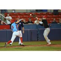 Spokane Indians scramble to base against the Vancouver Canadians