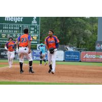 Infielder Jose King and the West Michigan Whitecaps celebrate a walk-off win