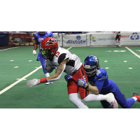 Jacksonville Sharks wide receiver Jared Dangerfield is tackled by the Columbus Lions