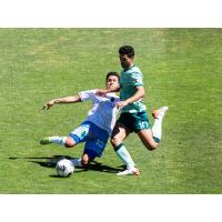 Las Vegas Lights FC midfielder Daniel Crisostomo slides in against San Diego Loyal SC