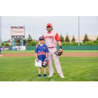 Ottawa Titans infielder A.J. Wright and a young fan