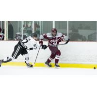 Yvan Mongo (Right) skating for the University of Ottawa