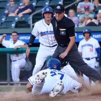 New York Boulders' David Vinsky slides into home