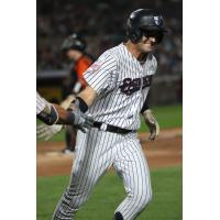 Max Burt of the Somerset Patriots circles the bases following his home run