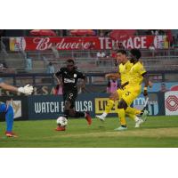 FC Tulsa forward Brian Brown (left)