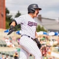 Austin Wells of the Somerset Patriots reacts after his grand slam