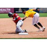 Mason McCoy of the Tacoma Rainiers get on base vs. the Salt Lake Bees