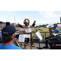 Charleston RiverDogs' mascot Charlie T. RiverDog directs the band