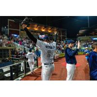Pensacola Blue Wahoos pitcher Sean Reynolds celebrates a comeback win