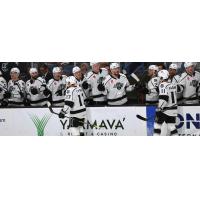 Ontario Reign's T. J. Tynan and Samuel Fagemo congratulate teammates