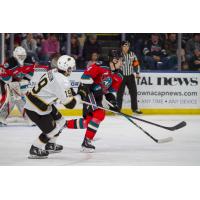 Kelowna Rockets defenceman Caden Price (right) vs. the Brandon Wheat Kings