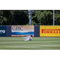 Rome Braves make a sliding catch in the outfield