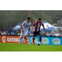 Atlético Ottawa midfielder Alberto Zapater Arjol (right) vs. Halifax Wanderers FC