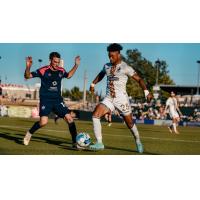 South Georgia Tormenta FC defender Davey Mason (left) vs. Union Omaha