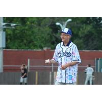 Evansville mayor Lloyd Winnecke throws out a first pitch at an Otters game