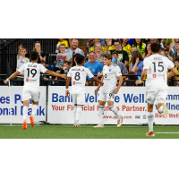 Louisville City FC's Oscar Jimenez, Carlos Moguel Jr., Jorge Gonzalez and Manny Perez celebrate win