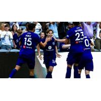 Louisville City FC's Manny Perez, Wilson Harris and Elijah Wynder celebrate win