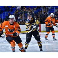 Lehigh Valley Phantoms' Brennan Saulnier and Nick Lappin and Wilkes-Barre/Scranton Penguins' Valtteri Puustinen on game night