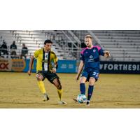 Union Omaha's Steevan Dos Santos battles South Georgia Tormenta FC's Jake Dengler