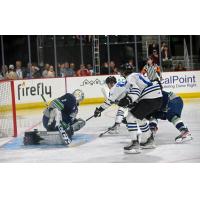 Wenatchee Wild forward Miles Cooper (center)