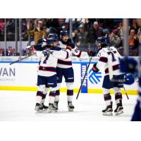 Saginaw Spirit's Calem Mangone, Matyas Sapovaliv and Michael Misa celebrate win