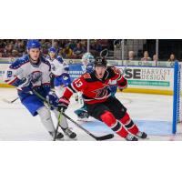 Wichita Thunder forward Peter Bates (left) vs. the Rapid City Rush