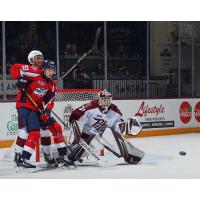 Windsor Spitfires' Owen Outwater and Peterborough Petes' Zachary Bowen in action