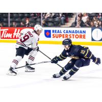 Red Deer Rebels centre Kai Uchacz (left) makes a move