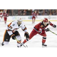 Kansas City Mavericks' Marc-Olivier Duquette and Rapid City Rush's Blake Bennett in action