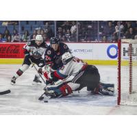 Kamloops Blazers' Blake Swetlikoff battles Kelowna Rockets' Caden Price and Jari Kykkanen