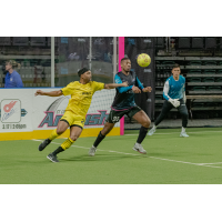 St. Louis Ambush defender Wil Nyamsi (right) eyes the ball against the Milwaukee Wave