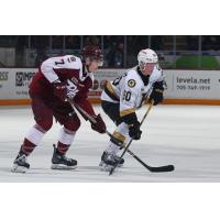 Peterborough Petes centre Chase Lefebvre (left) vs. the Kingston Frontenacs