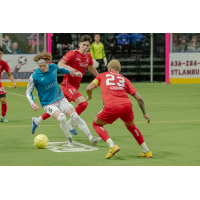 St. Louis Ambush forward John Eskay (left) vs. the Kansas City Comets