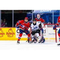 Wenatchee Wild's Evan Friesen and Spokane Chiefs' Nathan Mayes and Cooper Michaluk on the ice