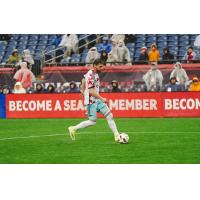 Chicago Fire with possession in the rain against the New England Revolution