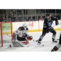 Kelowna Rockets' Jari Kykkanen and Wenatchee Wild's Briley Wood on the ice