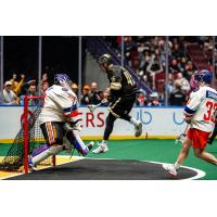 Halifax Thunderbirds' Warren Hill and Vancouver Warriors' Keegan Baland in action