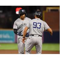 Somerset Patriots' Agustin Ramirez congratulated by coach Aaron Bossi