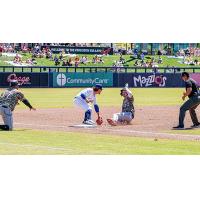 Taylor Young of the Tulsa Drillers makes the tag at third