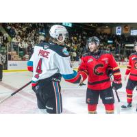 Kelowna Rockets' Caden Price congratulates Prince George Cougars' Hudson Thornton