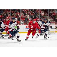 Saginaw Spirit's James Guoand and Soo Greyhounds' Justin DeZoete in action