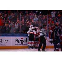 Kansas City Mavericks huddle after a goal