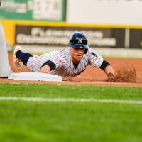 Jon Berti of the Somerset Patriots slides safely into base