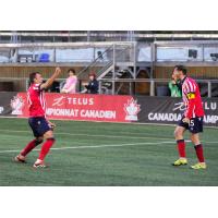 Maxim Tissot of Atlético Ottawa (right) celebrating his assist for Alberto Zapater's (left) goal