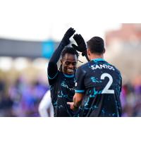 Colorado Springs FC's Ronaldo Damus congratulates Koa Santos